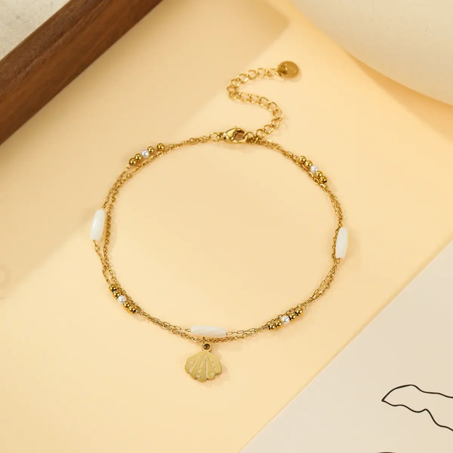 Chaîne de Cheville Double Chaîne Dorée et Pendentif Coquillage