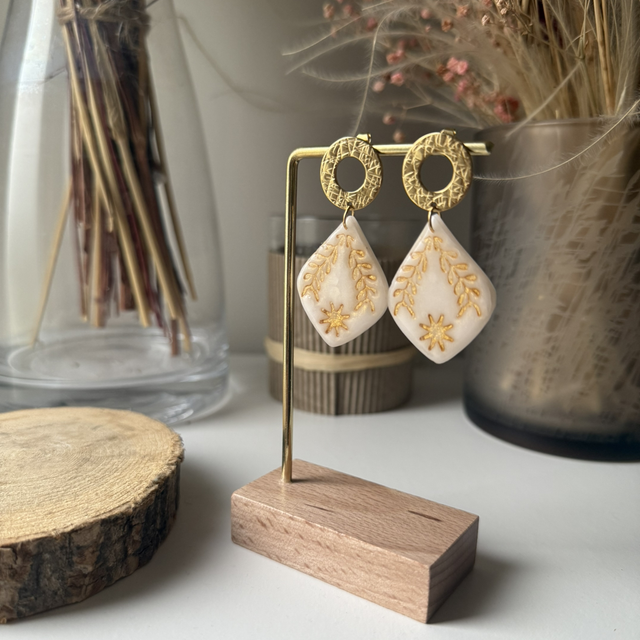 Plume blanc et doré