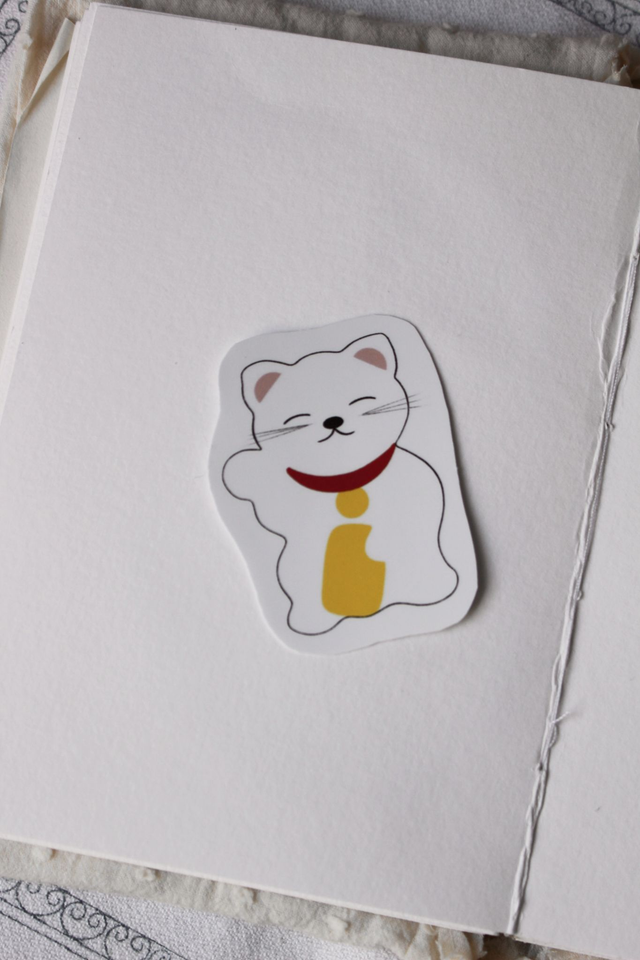 Sticker « Chat porte-bonheur »