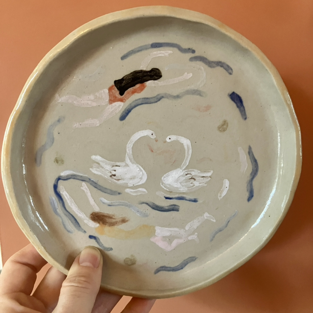 Small plate with swimming ladies and swans