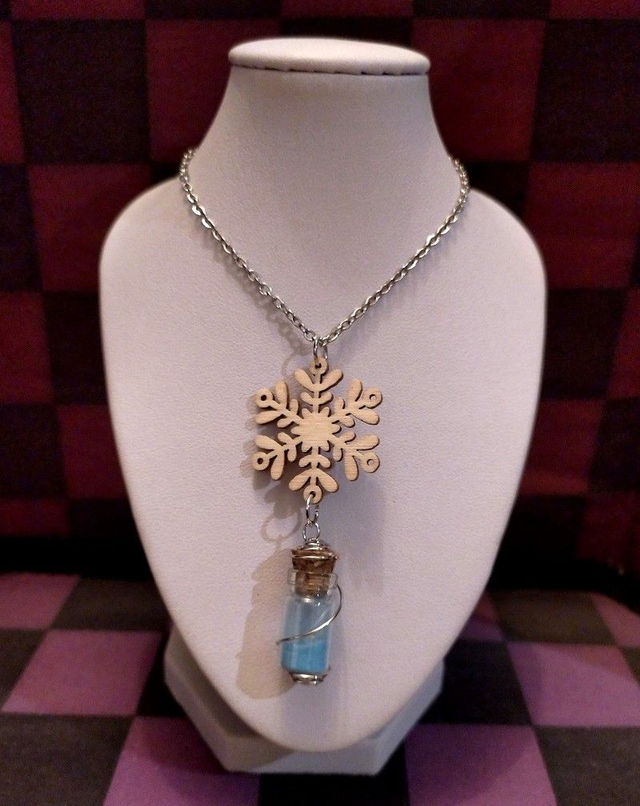Collier Noël flocon en bois &amp; fiole (contenu brillant dans le noir)