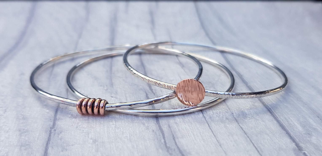 Sterling silver and copper bangle stack