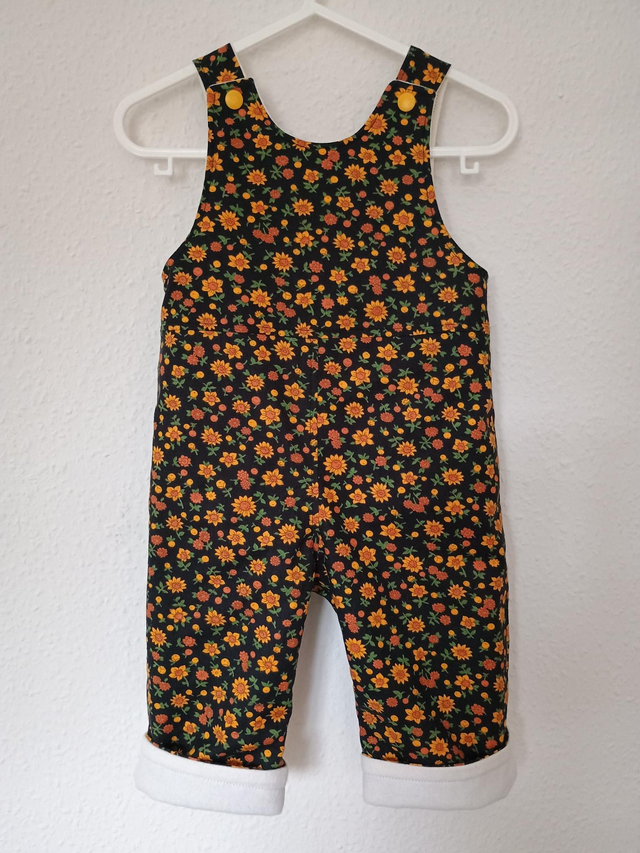 Dungarees - 6-9 mth (8 kg).   Black small yellow flower