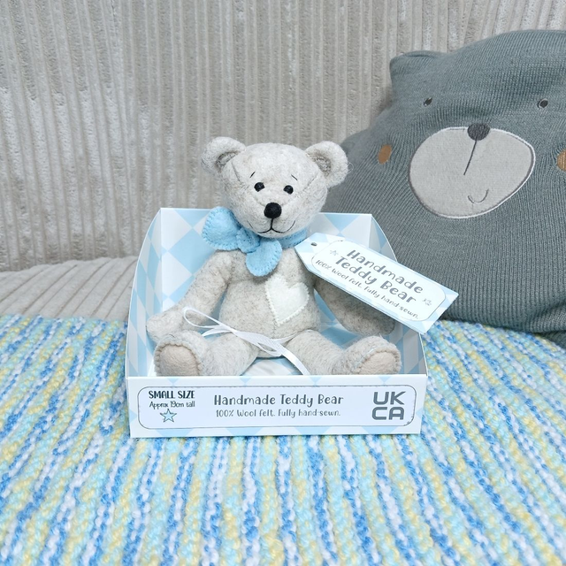 *No name* traditional beige bear. Baby blue bow tie. Small size, handmade teddy bear. UKCA. Tray base. Standard Wool Felt. Beige. Cream. 