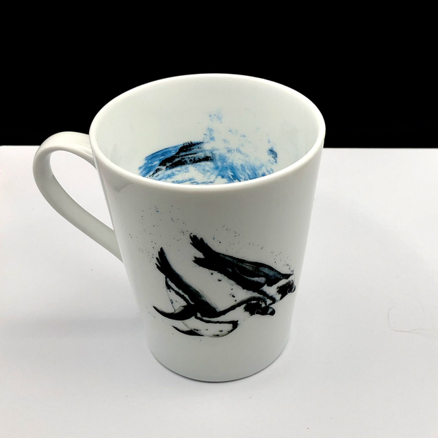 Humboldt penguins upcycled mug