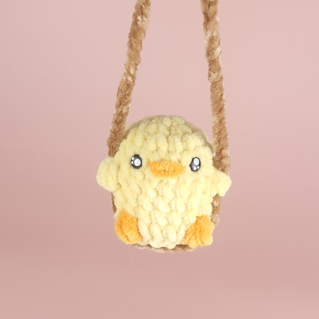 Poussin sur balançoire 