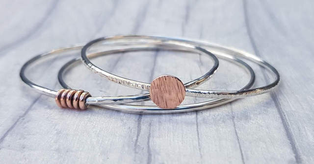 Silver and copper individual bangle.