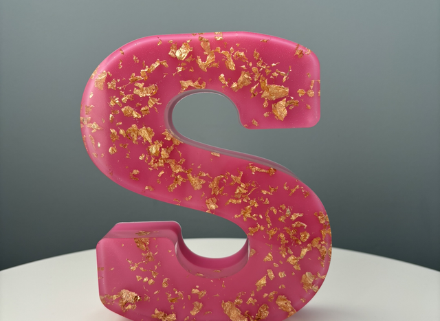 Large resin letter in pink and gold