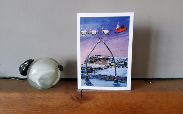 Father Christmas and his flying sheep over Whitby Whalebones. A6 Christmas card.