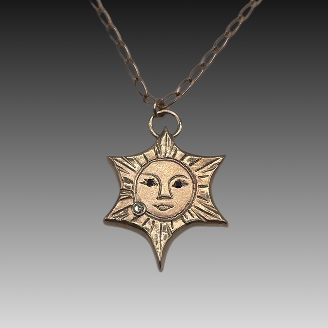 9ct yellow gold Sun with Black &amp; White Diamonds