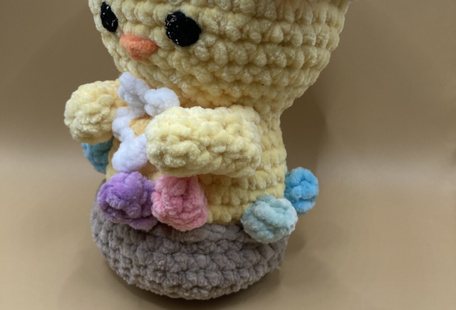 Poussin dans son nid