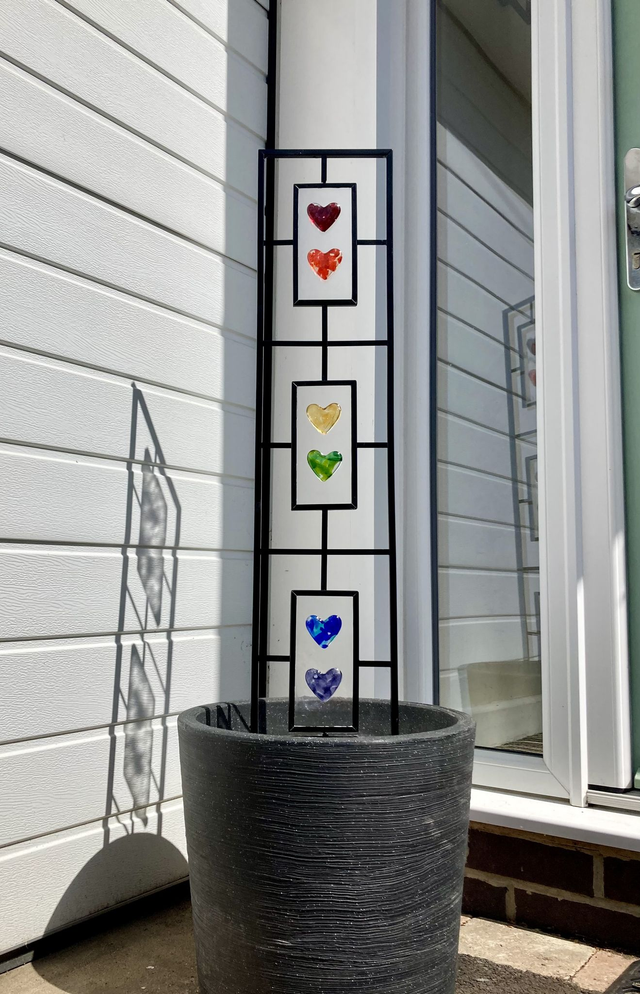 Rainbow Love garden trellis with fused glass panels