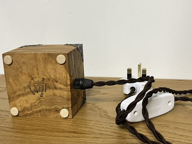 Rustic bedside lamp made of olive wood.