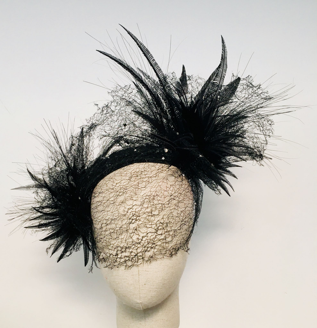 Black duchesse satin headpiece with veil, feathers, and Swarovski crystals
