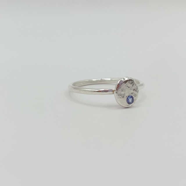 Hammered sterling silver disc ring with blue stone (size O)