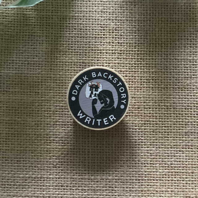 Wooden Pin Badge - Dark Backstory Writer