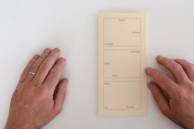 HAND MOVES ORANGE ORANGE LIGHT FALLS FALLS ON HANDS