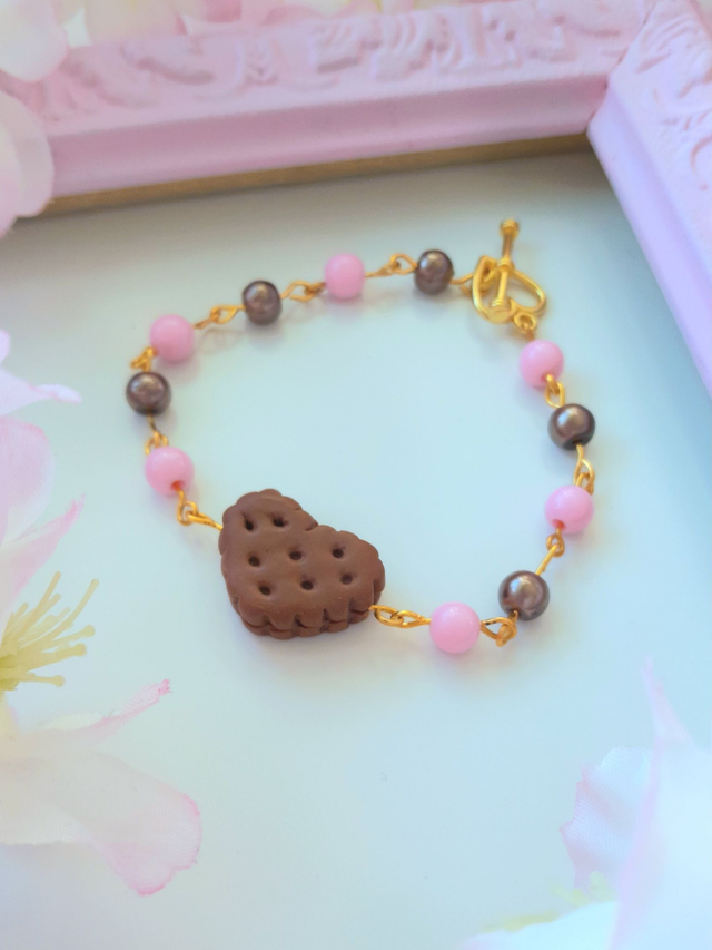 Keksikäsikoru - mansikkasuklaa (kultaväri)