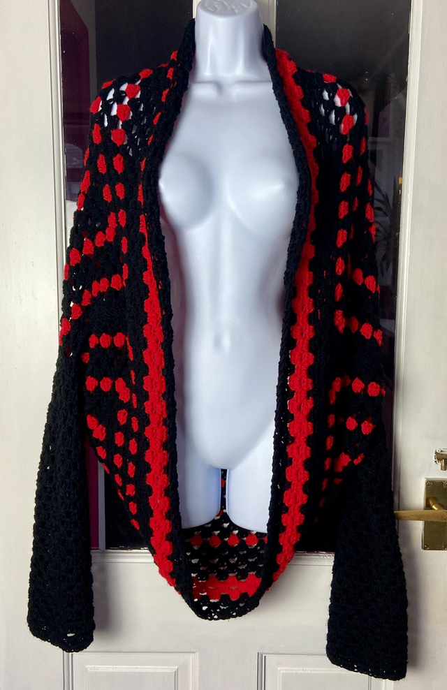 Red and black shrug cardigan.