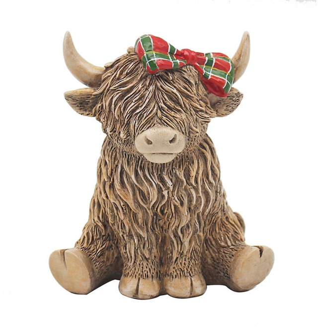 Highland cow with tartan bow