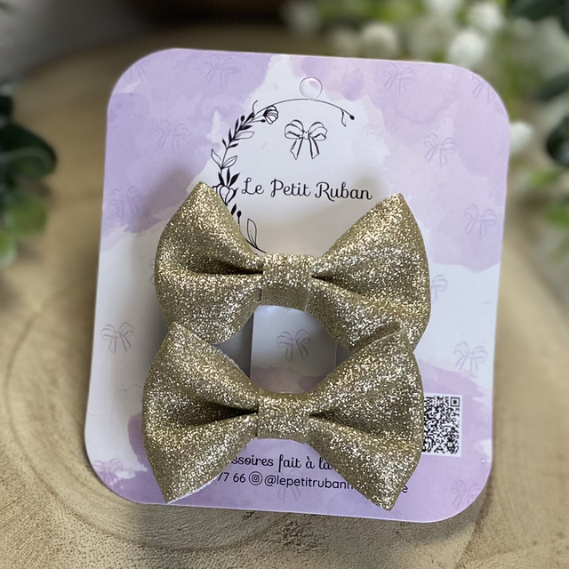 Paire de petites barrettes pailletées dorées 
