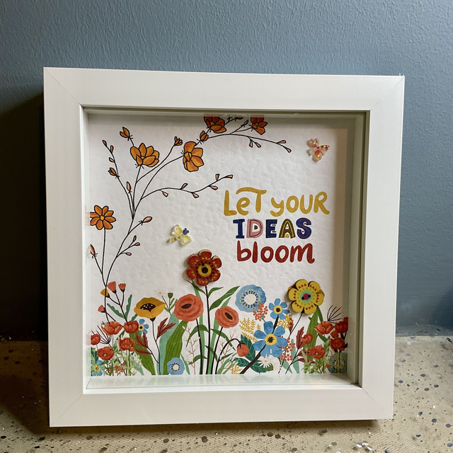 Buttons frame with inspirational quote.Flower design  
