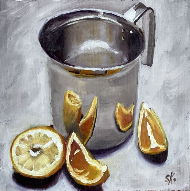 Chromkanne mit Orangen