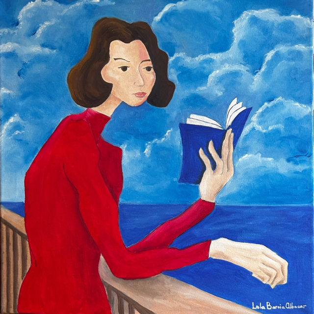 Mujer de rojo leyendo frente al mar