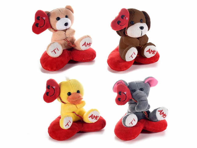Peluche su cuscino a cuore con palloncino e scritta Ti amo