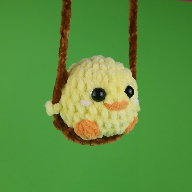 Poussin sur balançoire 