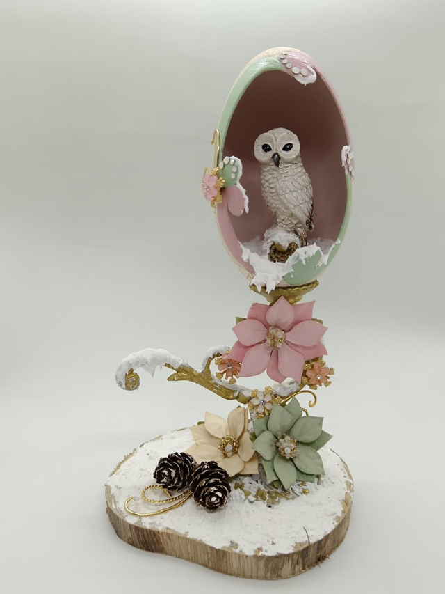 White snow owl in a goose egg 