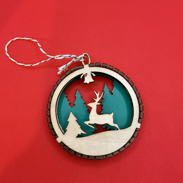 Laser cut Christmas ornament. Wooden design.