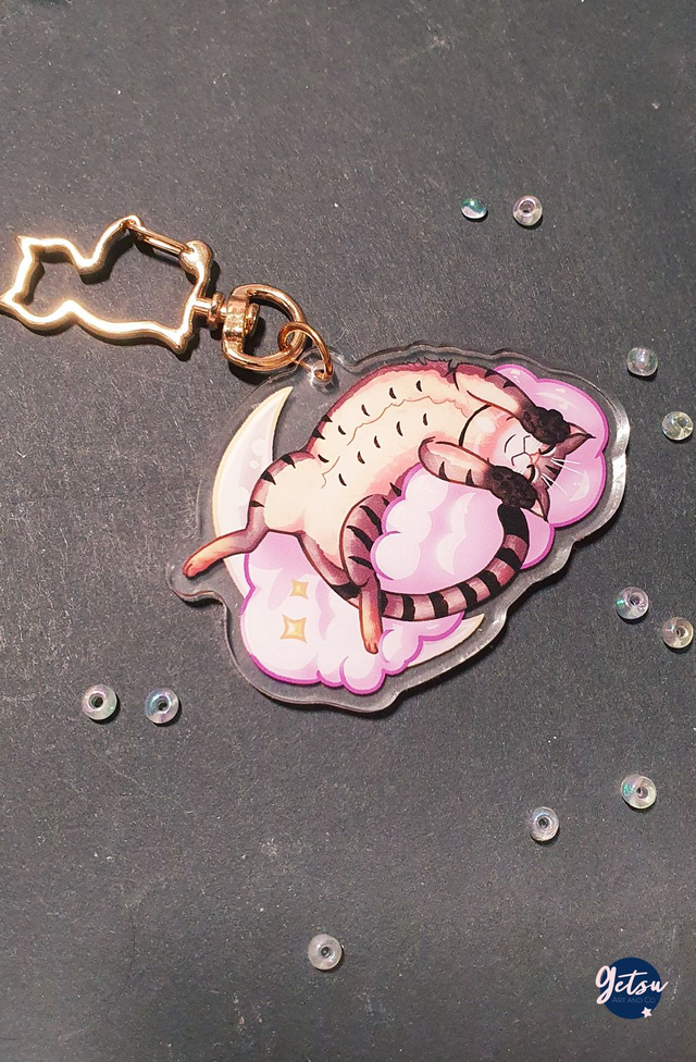 Porte-clef chat couché sur un nuage