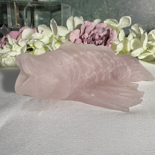 Hand carved rose quartz koi carp