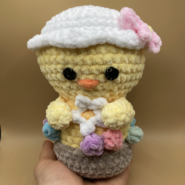 Poussin dans son nid