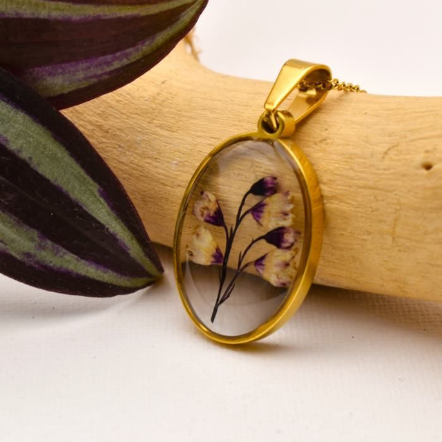 Subtile Heuchera flowers in oval pendant