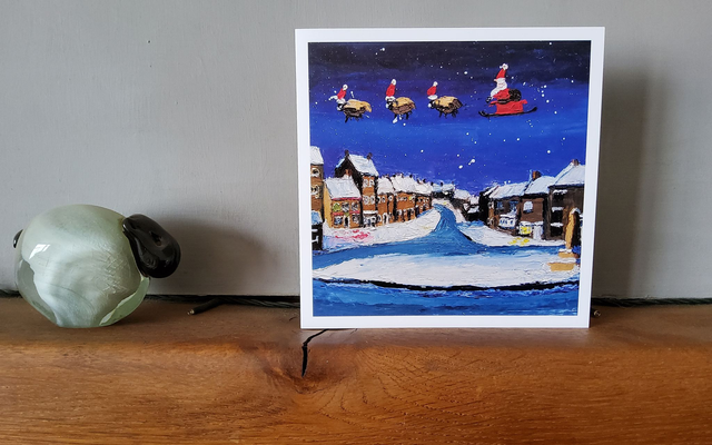 Father Christmas flying over Osmotherley Village. 6x6" Christmas card.
