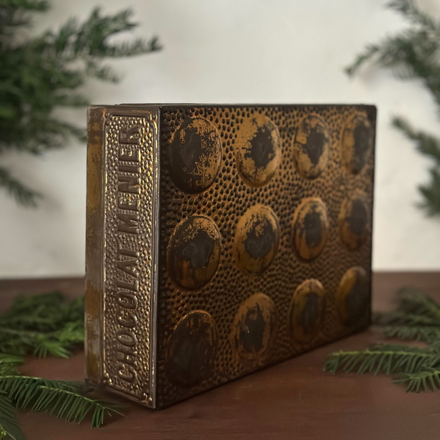 l'ancienne boîte en métal Chocolat Menier