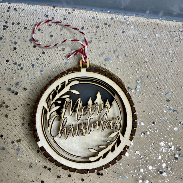 Laser cut Christmas ornament. Wooden design.