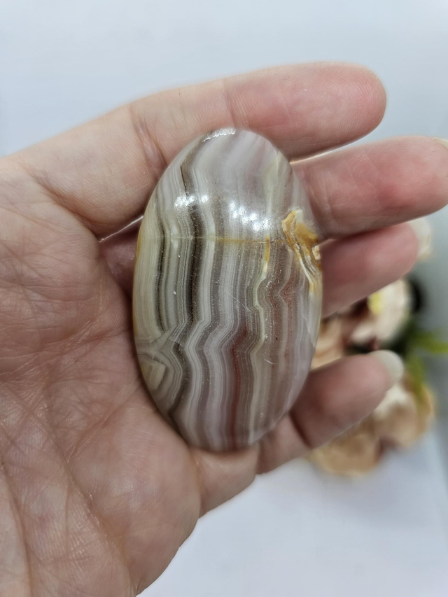 Pink banded calcite palmstone 