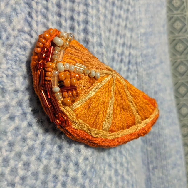 Orange brooch 