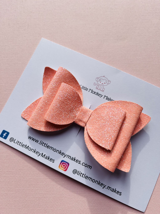 Pale pink glitter bow