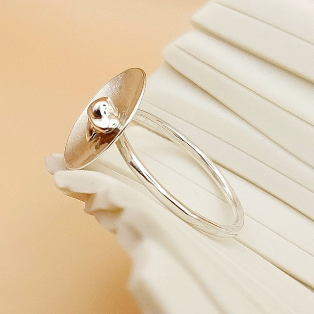 Sterling silver satin finish domed disc ring with silver nugget