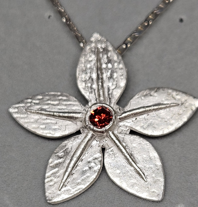Flower, flat petal pendant with padparadscha cubic zirconia