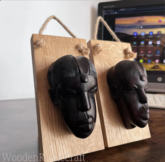 Pair of Ebony Head Sculptures on Oak Wall-Mounting Bases