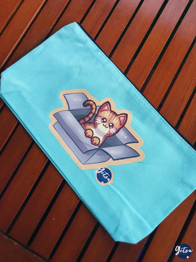 Trousse bleue chat roux