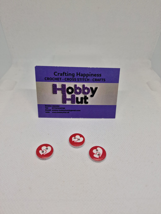 Red Buttons With Two White Hearts