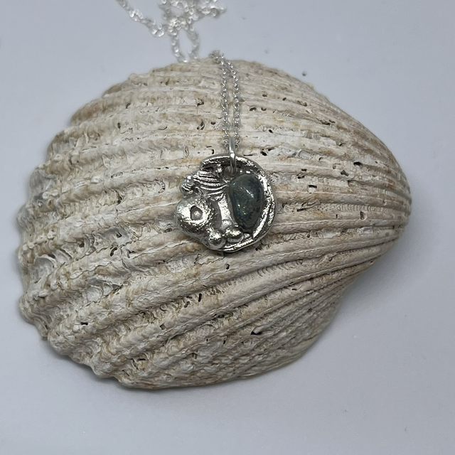 Small sterling silver rock pool pendant with sea glass