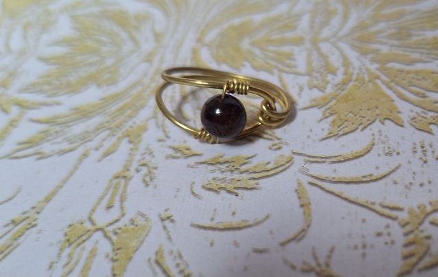 the prophet in gold with garnet, size 50