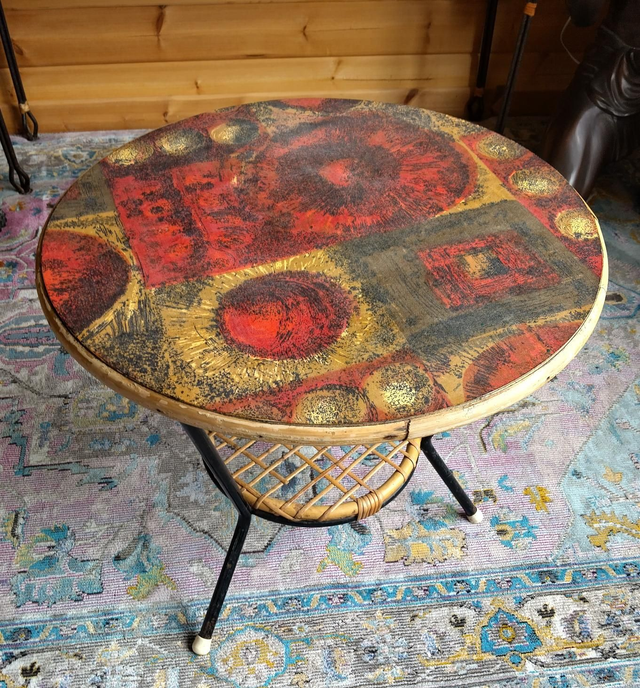 Vintage 1960s/70s coffee table. Psycedellic patterned circular top, tubular legs and cane lower shelf 